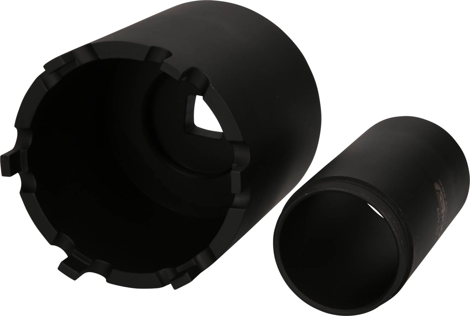 Deux couronnes de forage noires en métal, l'une couchée, l'autre debout. Elles ont des tailles différentes et sont destinées aux travaux de béton.