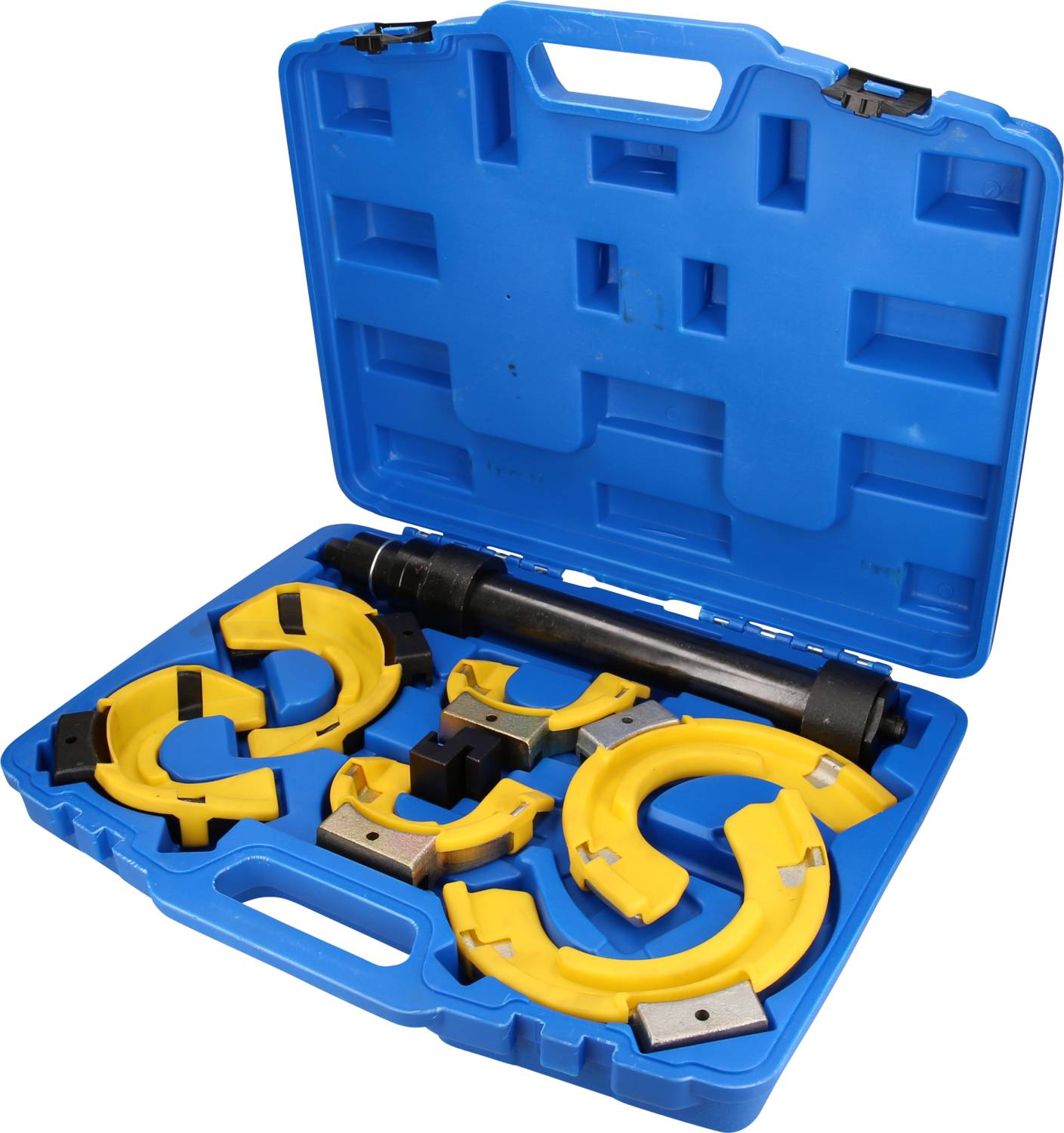 Une valise bleue ouverte contenant des outils jaunes et noirs, dont différents adaptateurs et un long cylindre, probablement un tendeur de ressort.