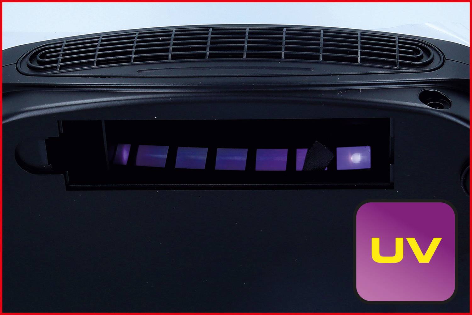 Un indicateur de lumière UV dans un appareil, signale le mode UV activé par un voyant lumineux violet.