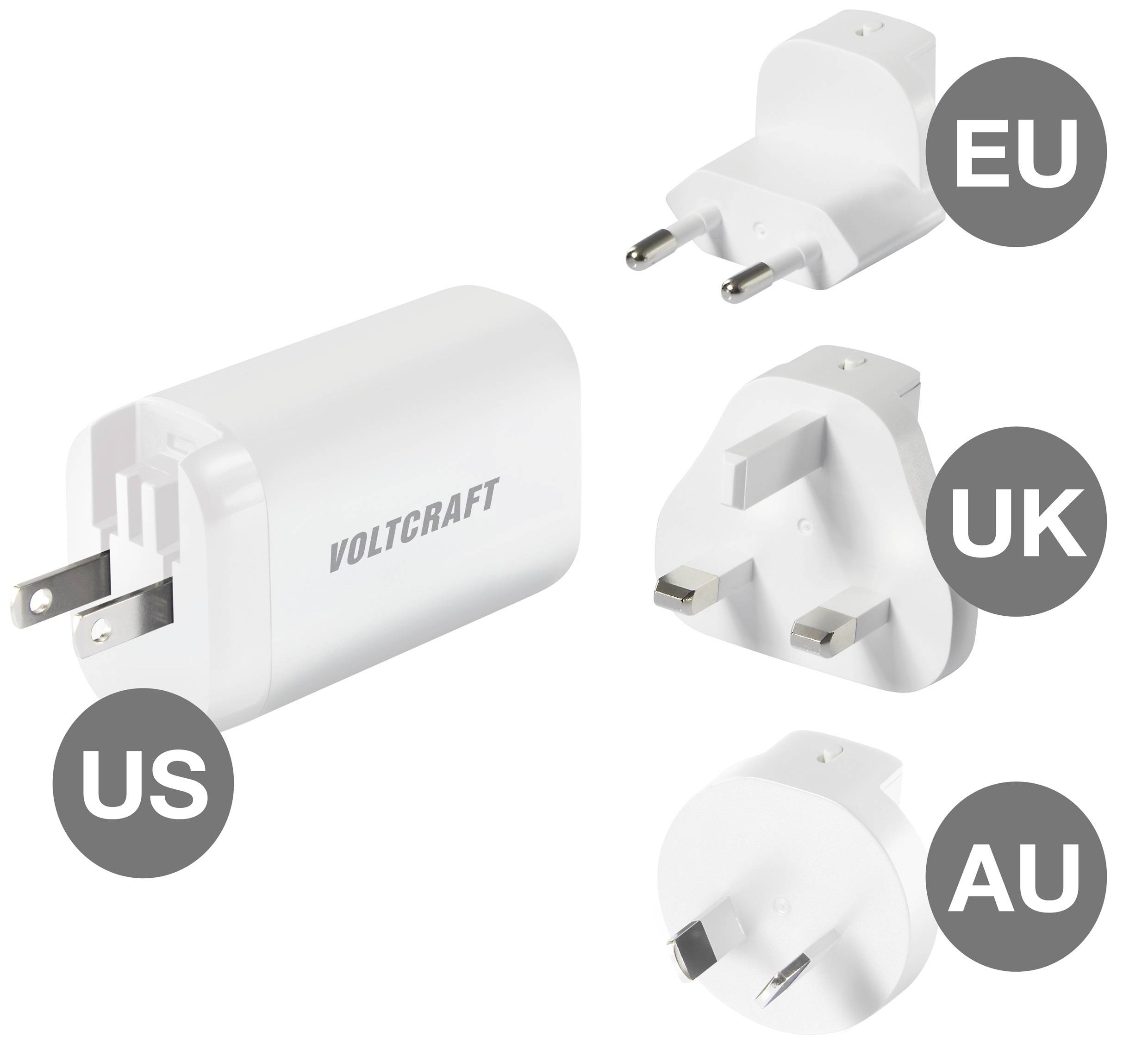 Un chargeur de voyage avec quatre adaptateurs interchangeables pour l'UE, le Royaume-Uni, les États-Unis et l'Australie. Nom de marque 'Voltcraft' sur le chargeur.