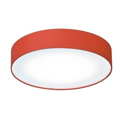 Luminaire rond et rouge au plafond, avec un intérieur blanc et lumineux.