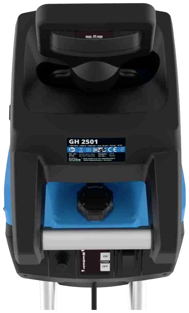 Machine électrique vue de dessus avec un boîtier bleu et un panneau de commande noir. Étiquettes 'GH 2501' et certificats CE visibles.