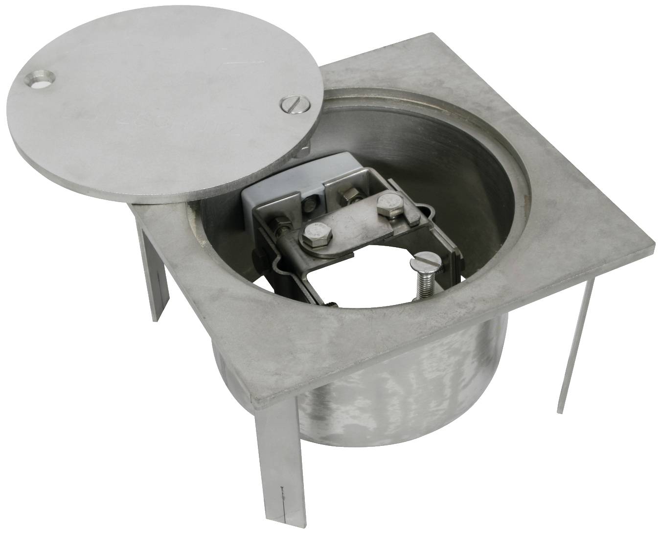 Un boîtier d'encastrement rond en métal avec des vis apparentes et un couvercle révèle l'intérieur d'un boîtier de raccordement électrique.