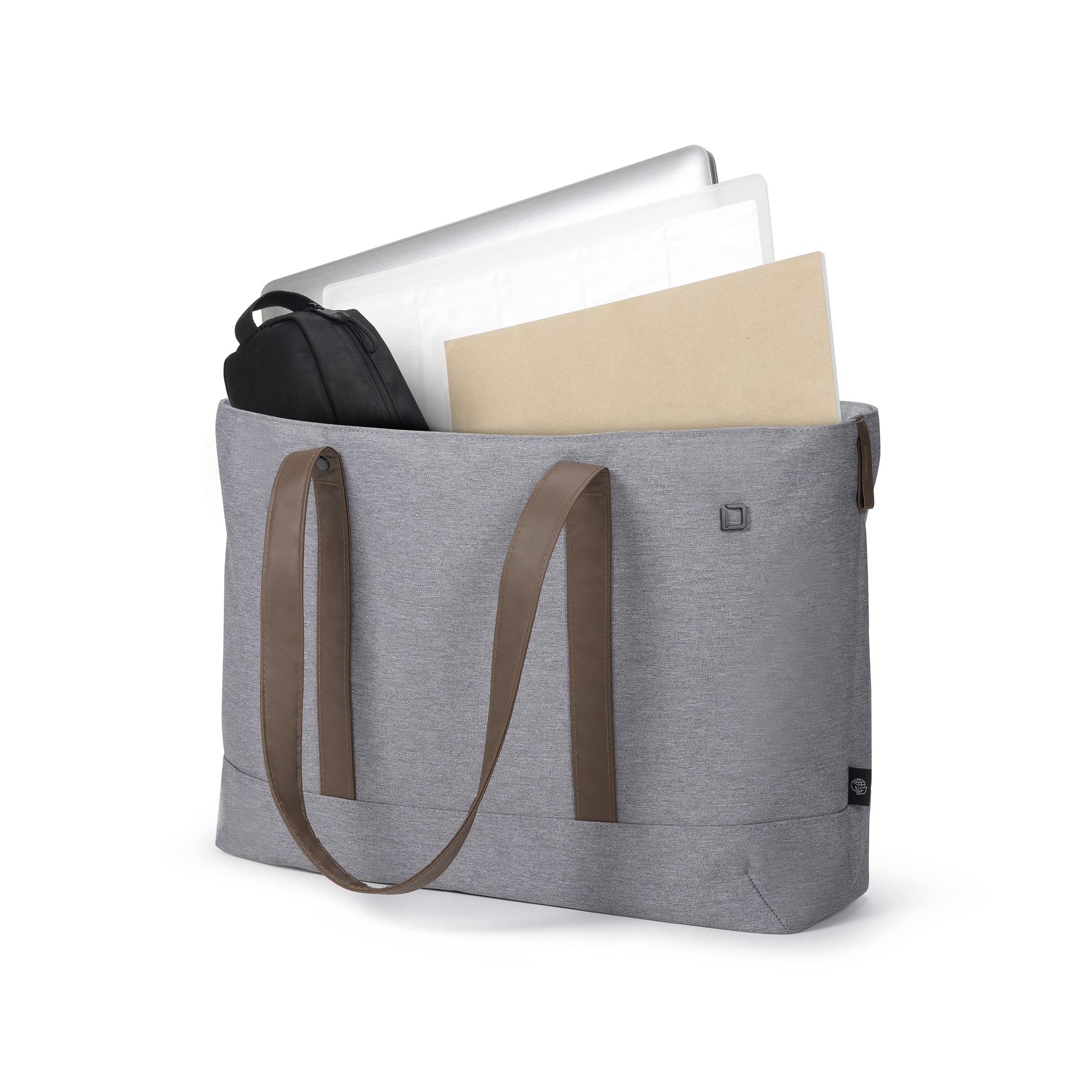 Sac en tissu gris avec des anses brunes, contenant un ordinateur portable, une housse noire et un document marron.