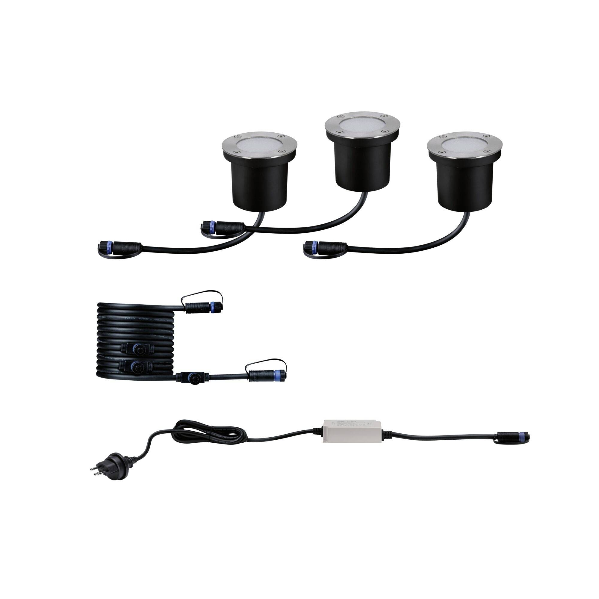 Trois spots LED encastrables ronds noirs avec câbles et connecteurs, un rouleau de câble et un adaptateur secteur avec fiche.