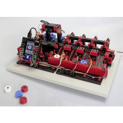 Un robot LEGO qui trie des CD, avec un écran connecté affichant des informations de contrôle. Des blocs colorés et des CD sont visibles.