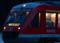 Un train régional rouge de la Deutsche Bahn portant l'inscription 'RE25 Gießen' brille dans l'obscurité.