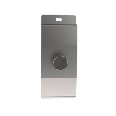 Un objet métallique rectangulaire gris avec un bouton rotatif au centre.