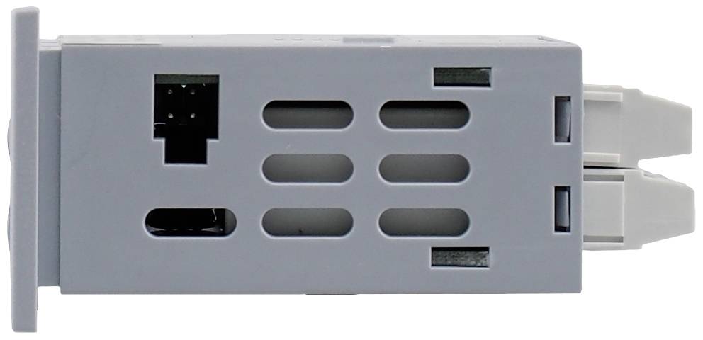 Un appareil gris, rectangulaire, de type ventilateur, avec des fentes de ventilation et deux connecteurs blancs sur le côté droit.