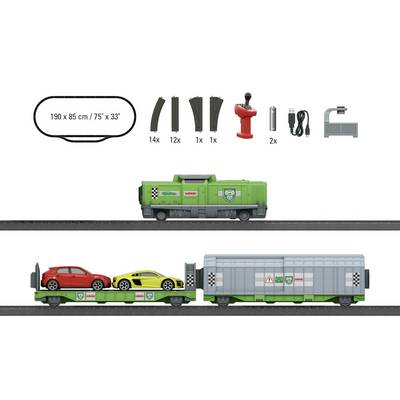 Set de train miniature avec wagon locomotive vert, un wagon comprenant deux voitures, et accessoires tels que rails et outils. Dimensions : 190 x 85 cm.
