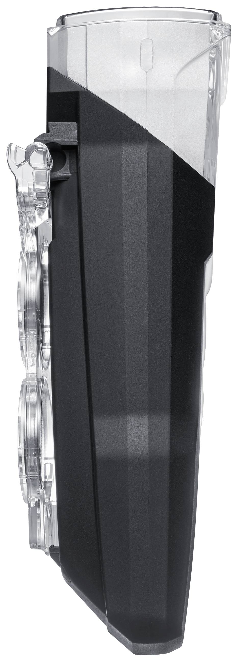 Tête de rasoir électrique, transparente et noire, à surface structurée.