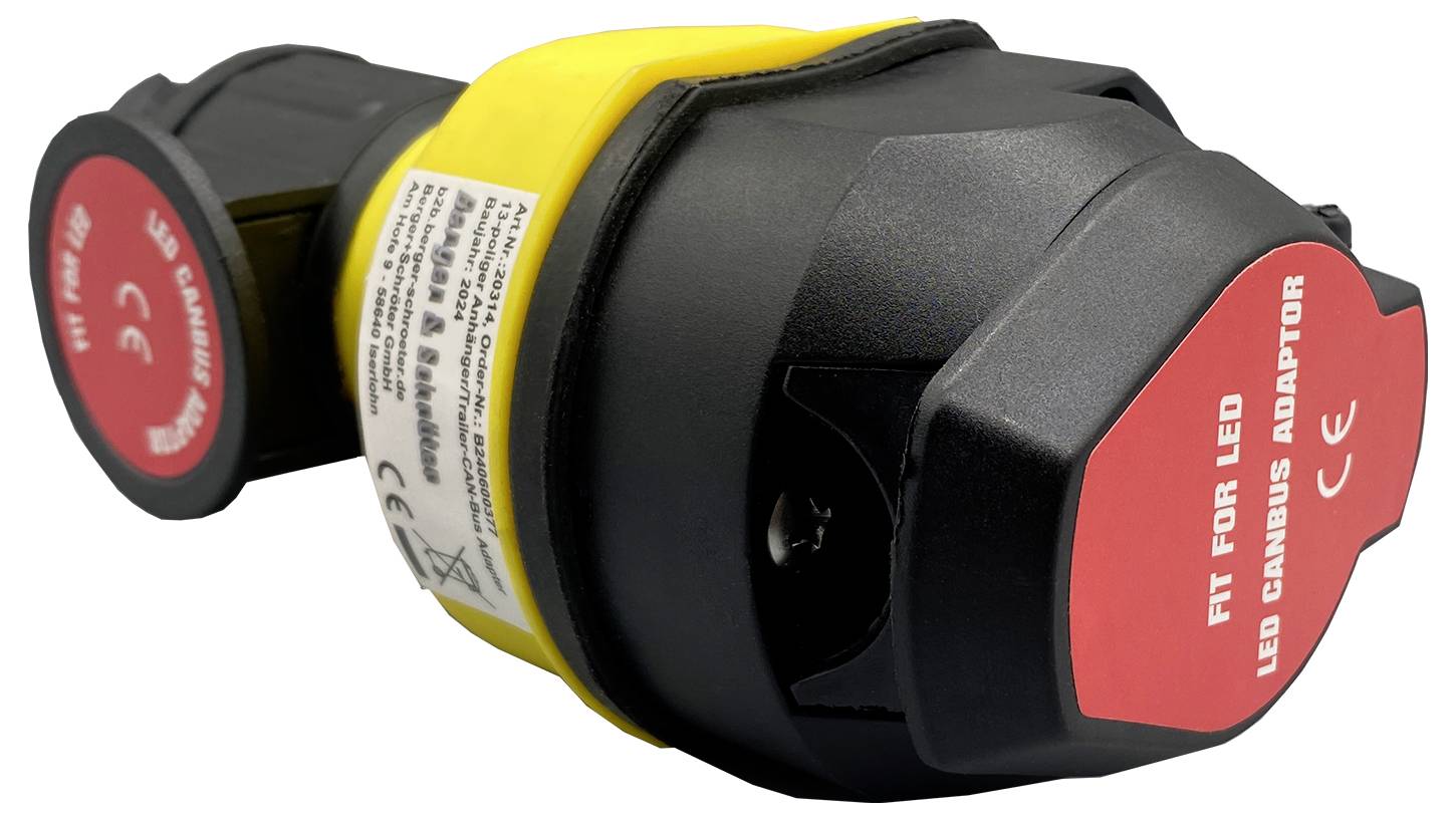 Un adaptateur LED noir et jaune avec une étiquette rouge sur laquelle est inscrit 'FIT FOR LED LED CANBUS ADAPTOR'. Adaptateur pour éclairage.
