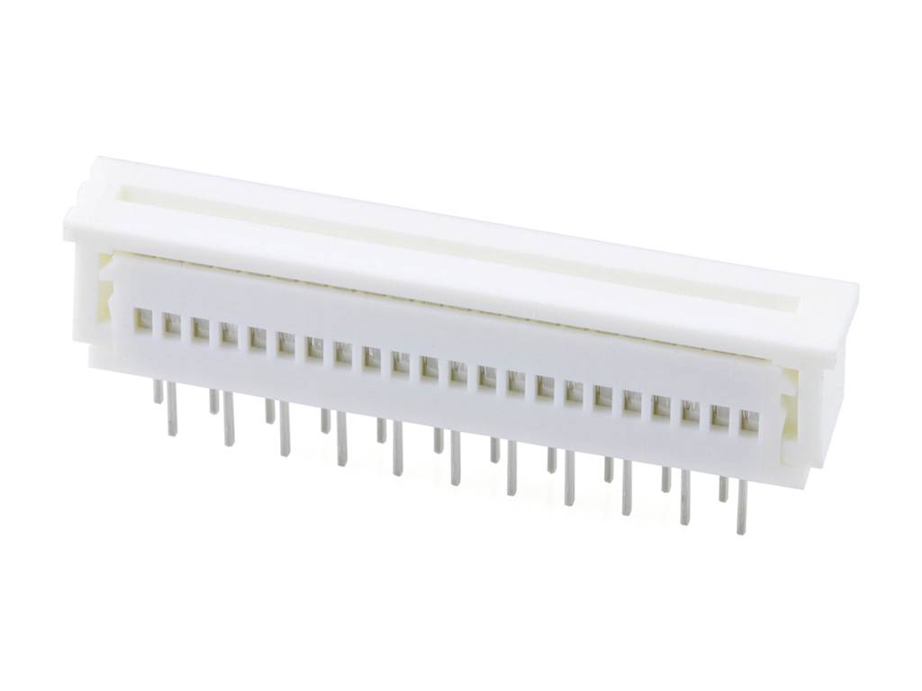 Un connecteur blanc rectangulaire avec plusieurs broches métalliques en dessous, utilisé pour la connexion électronique entre des appareils.