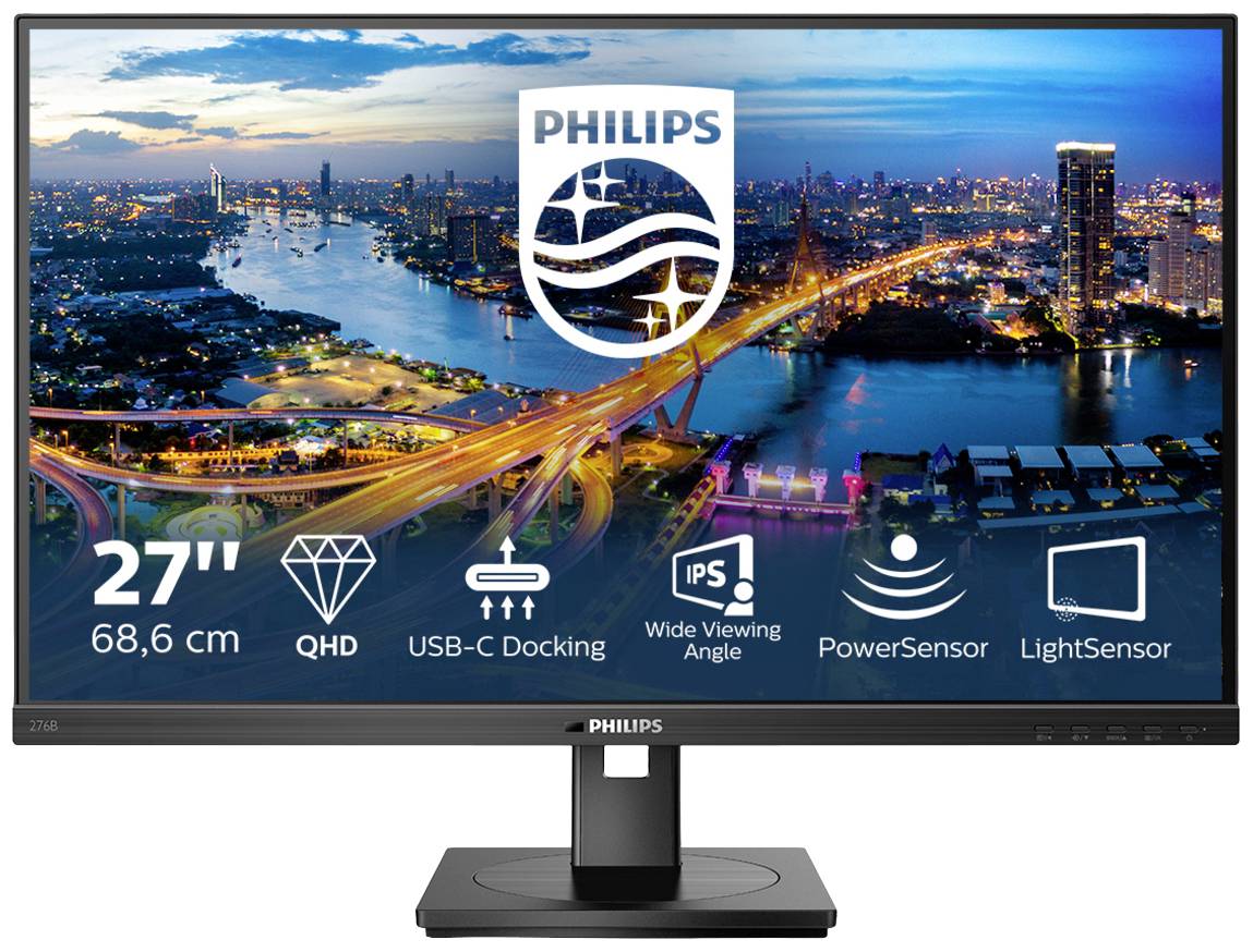 "Moniteur Philips de 27 pouces au-dessus d'un panorama urbain nocturne" présente les caractéristiques principales : QHD, station d'accueil USB-C, IPS, PowerSensor, LightSensor.
