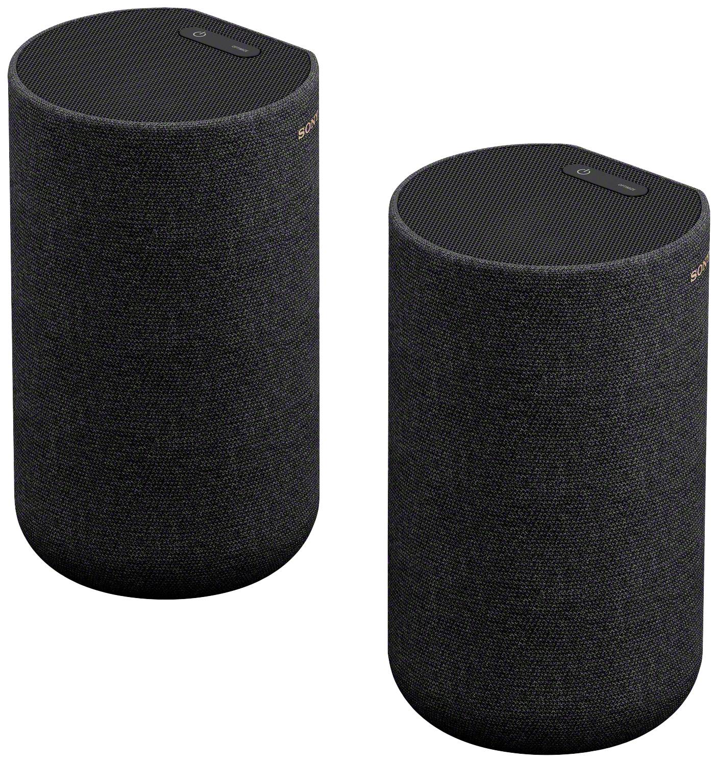 Deux enceintes cylindriques noires recouvertes de tissu sont placées côte à côte. Elles sont conçues de manière moderne et conviennent à la reproduction audio.