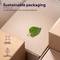 Emballage durable en matériau recyclé, montrant des cartons avec une feuille dessus. Textes : 'Volume optimisé', 'Réduction d'encre'.
