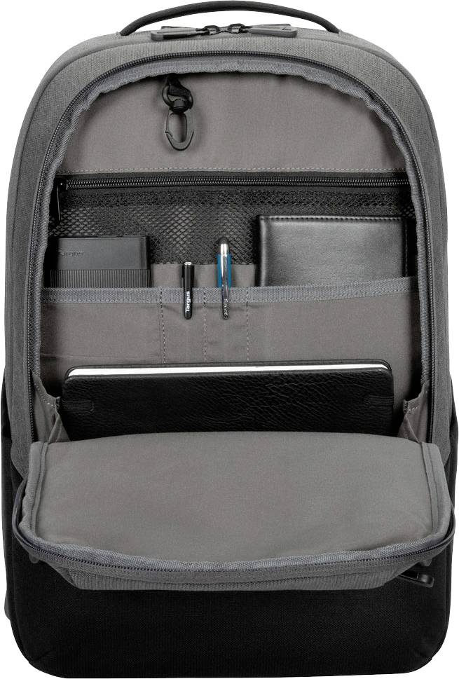 Sac à dos gris ouvert avec des compartiments contenant des stylos, un cahier et un ordinateur portable. Idéal pour le bureau ou l'école.