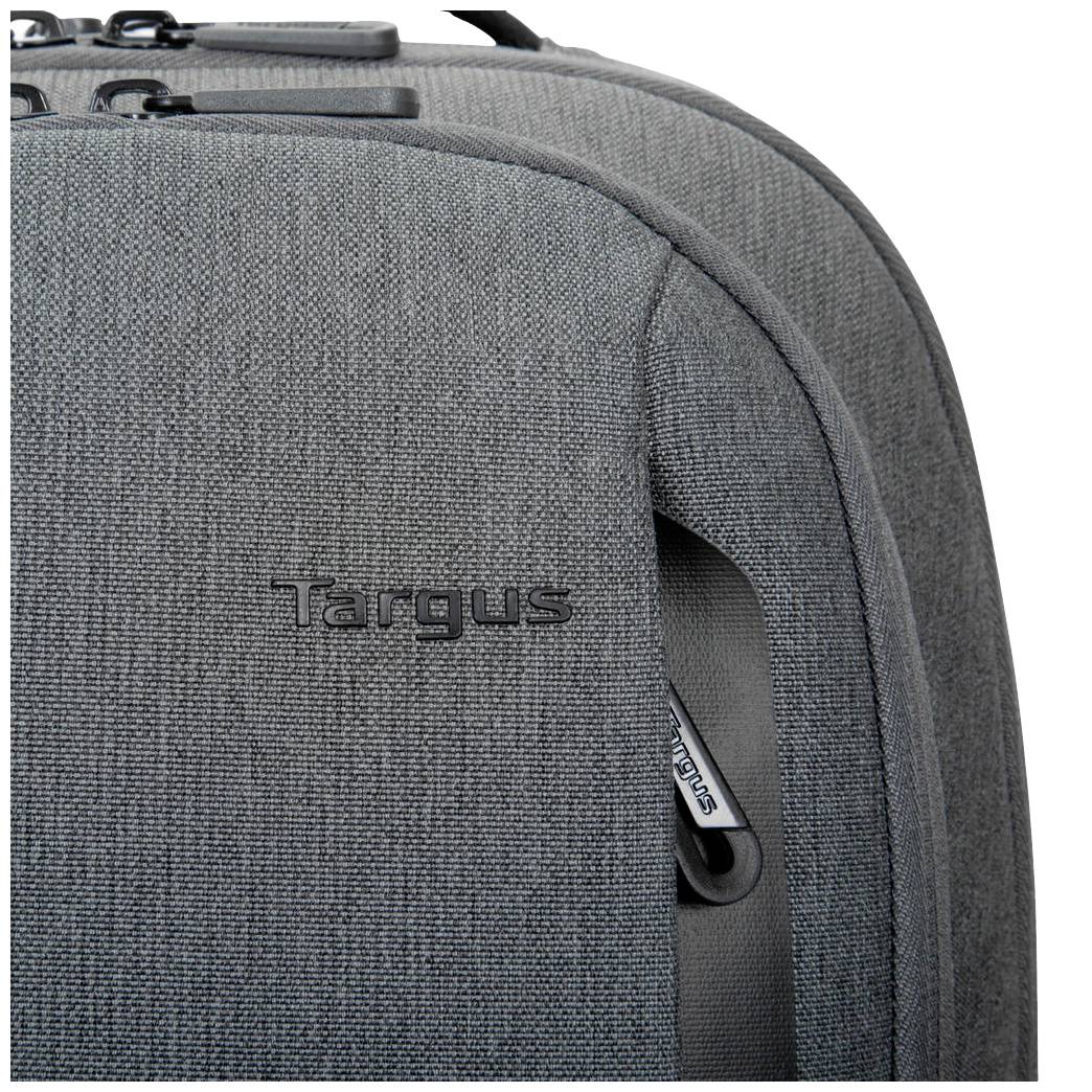 Sac à dos gris texturé avec l'inscription 'Targus' sur la face avant, une fermeture éclair partiellement visible sur le côté droit.