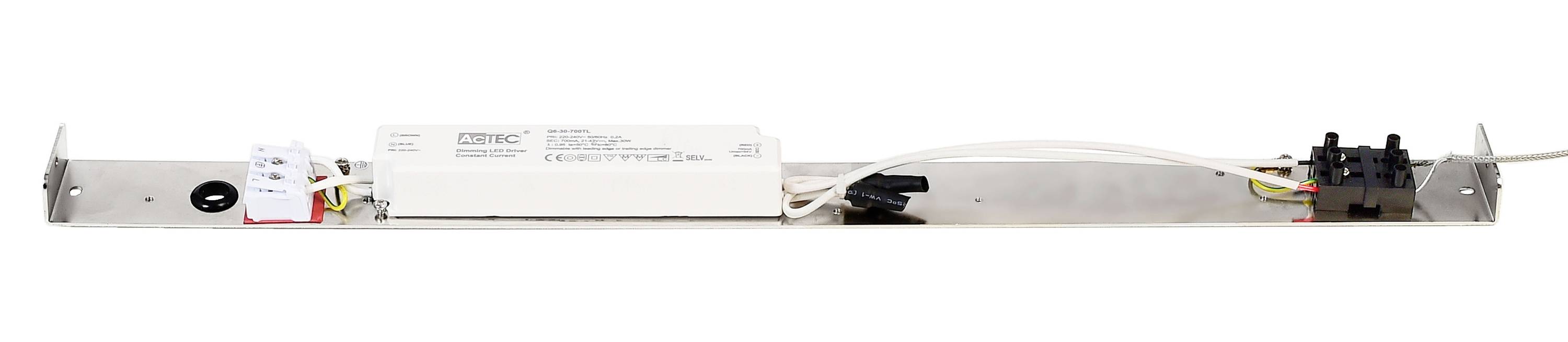 Longue barre électronique étroite avec des câbles et des connexions, montée sur une bande métallique. Utilisée pour des installations techniques.