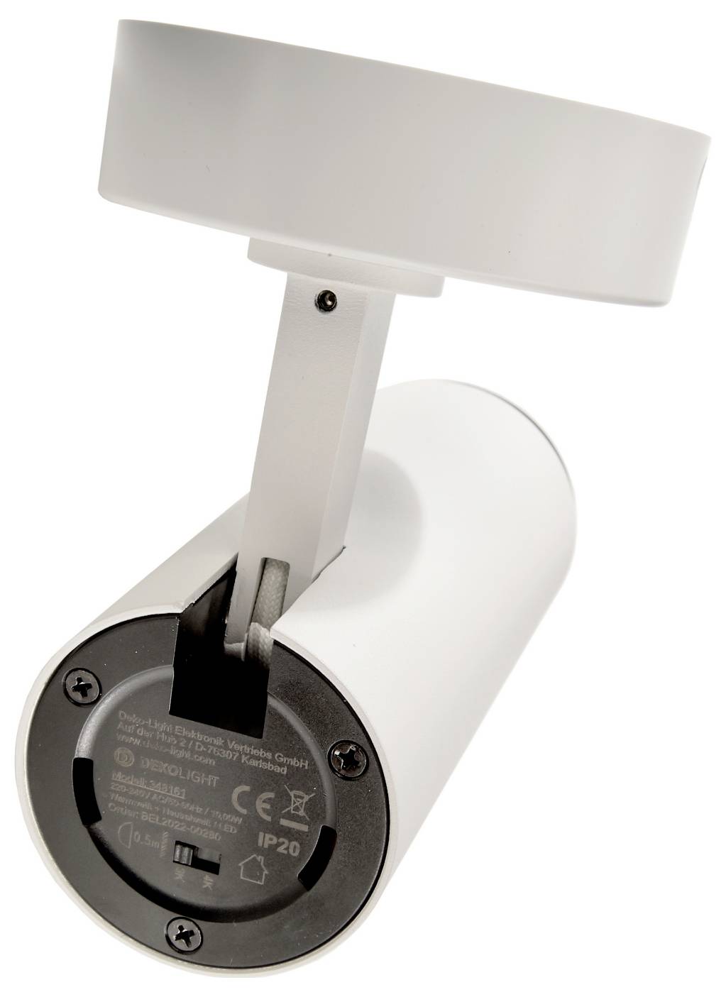 Spot LED orientable blanc sur une base de fixation cylindrique, vu de dessous sur fond blanc.