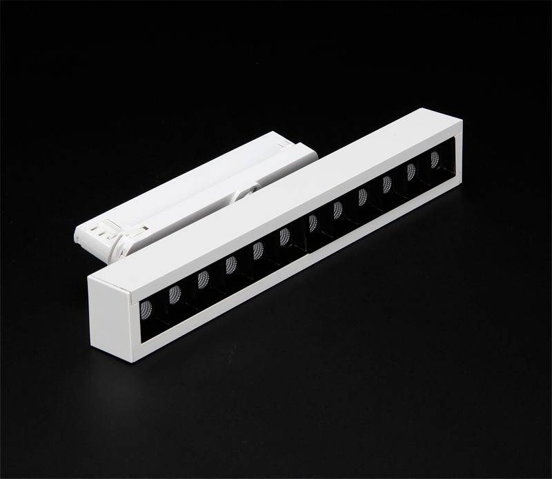Une barre lumineuse LED blanche, rectangulaire, avec plusieurs ouvertures lumineuses rondes sur un fond noir.