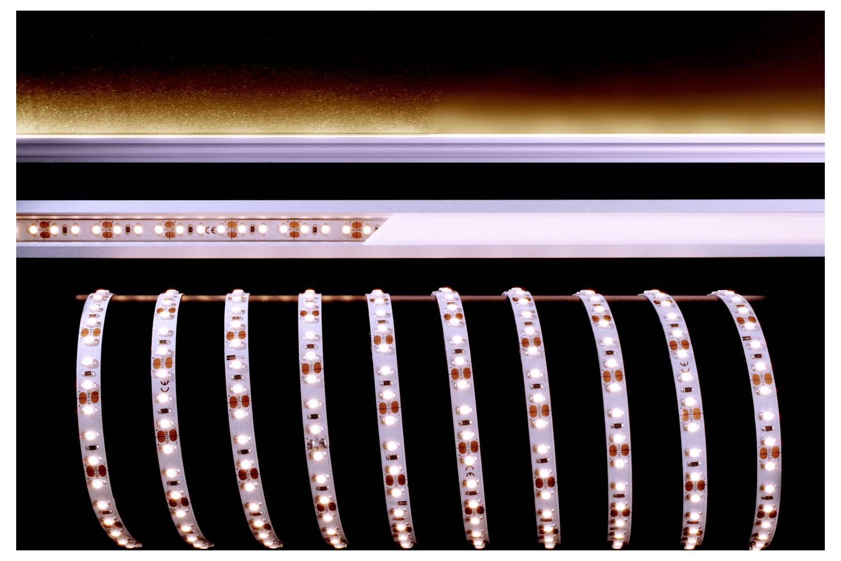 Gros plan de bandes LED enroulées en boucles parallèles, diffusant une lumière blanc chaud et ambrée sur fond noir.