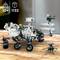 Un kit de construction d'un rover martien de 1132 pièces pour enfants à partir de 10 ans, présentant le rover sur une surface en bois avec un petit hélicoptère.