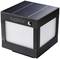 Lampe solaire compacte de forme cubique avec cadre noir et panneau blanc lumineux, adaptée à l'éclairage extérieur.