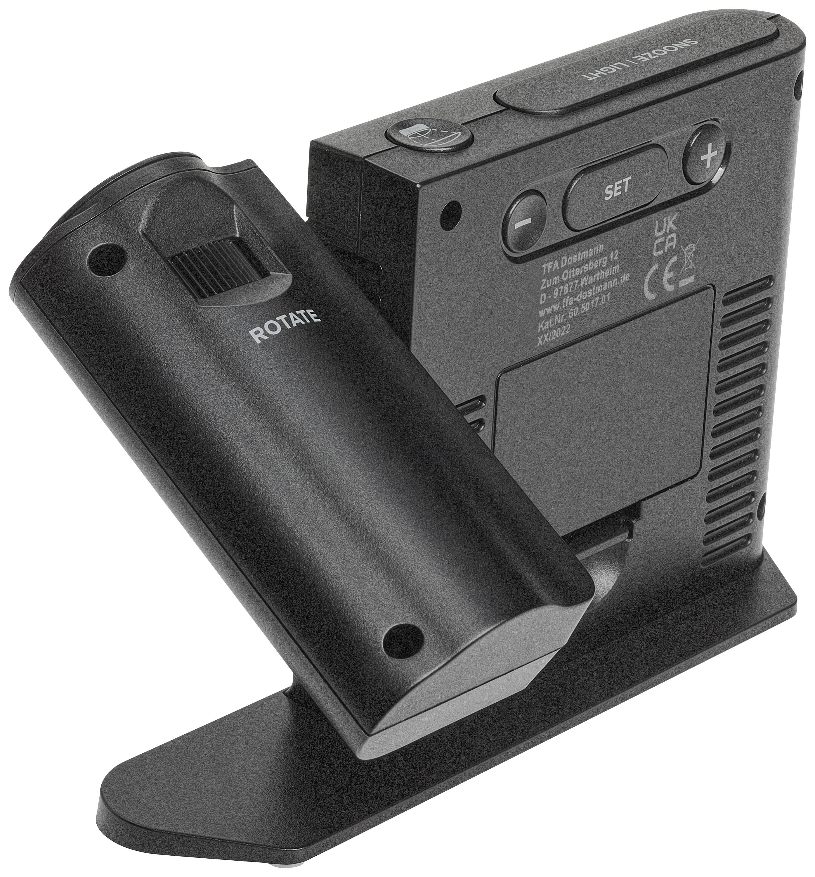 Appareil portable noir avec un écran sur l'arrière. Il dispose de touches et d'un bouton rotatif pour le contrôle. Adapté pour une utilisation sur table.