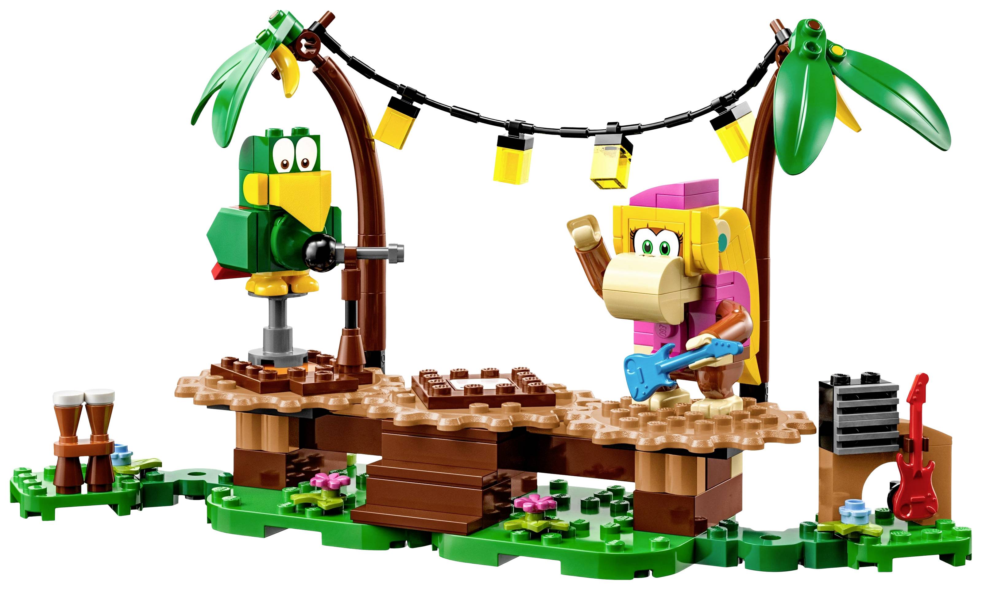 Une scène LEGO avec un perroquet et un singe sur une scène tropicale. Le perroquet est assis au micro, le singe joue de la guitare électrique. Des lumières de scène sont accrochées aux palmiers.