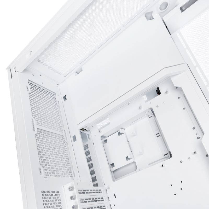Boîtier d'ordinateur blanc vu de l'intérieur, montrant l'espace vide pour les composants tels que la carte mère et les disques durs.