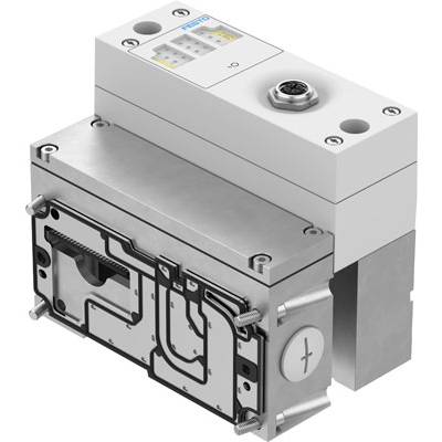 Un module de vanne mécanique gris avec le logo Festo en haut à gauche. Le composant présente différentes connexions et un élément de vis.