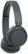 Casque noir sans fil, de type over-ear, avec coussinets d'oreilles rembourrés et arceau. Nom de la marque visible sur l'arceau.
