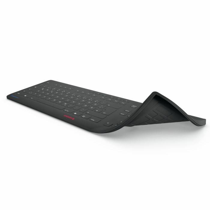 Clavier noir flexible, partiellement enroulé, montrant sa nature souple. Idéal pour les utilisateurs mobiles en raison de sa portabilité.