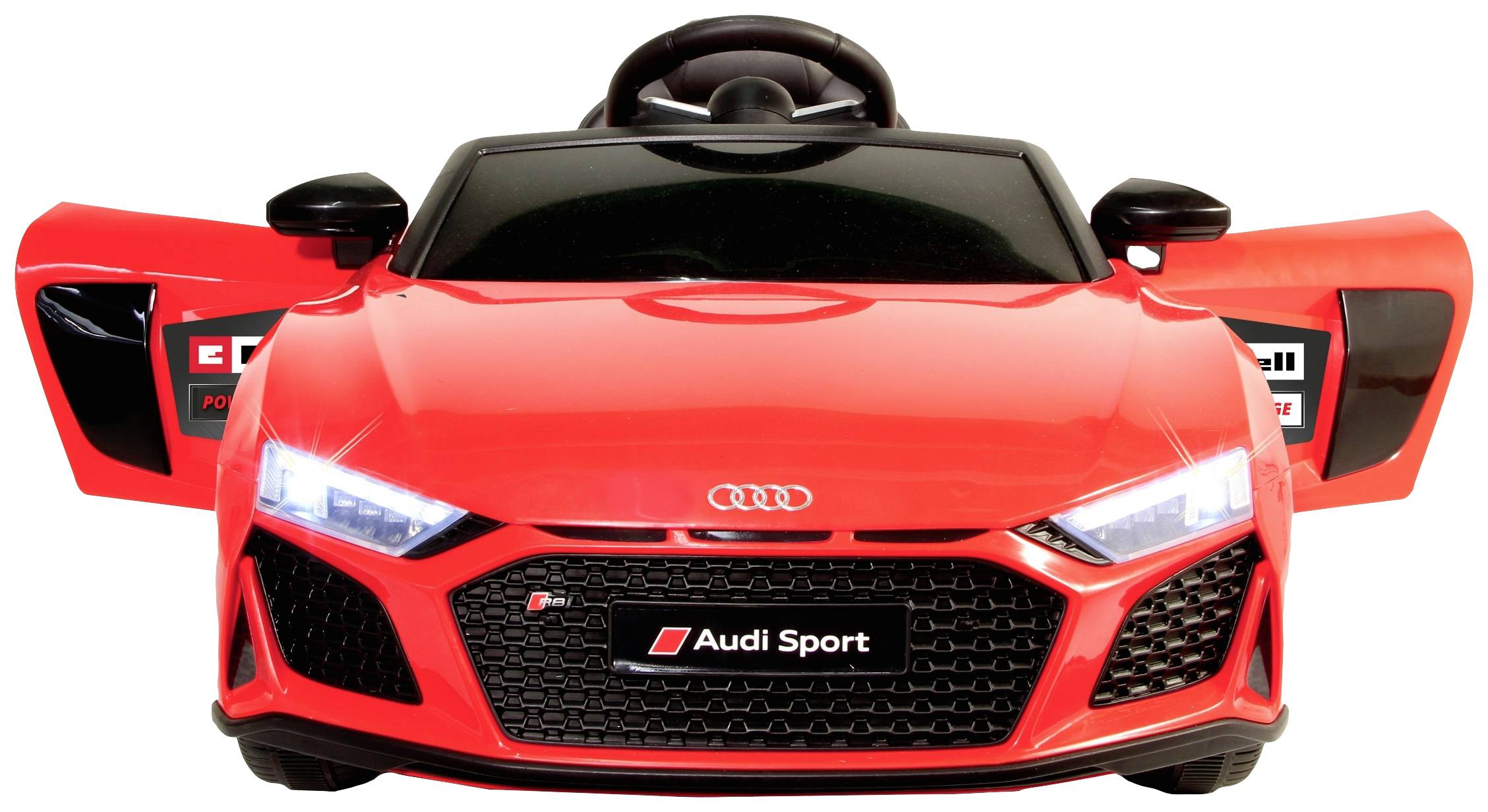 Petite voiture de jouet rouge au design Audi, avec portes ouvertes et volant visible, placée sur un fond uni.