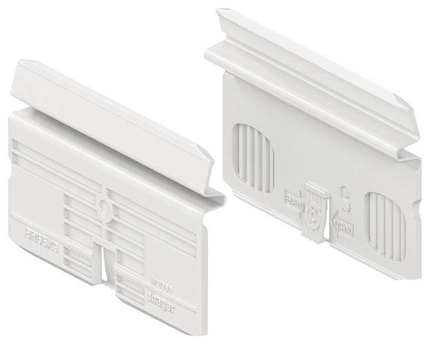 Deux pièces en plastique blanc avec des surfaces structurées et des bords dentelés. Elles semblent faire partie d'un système de montage ou de connexion.