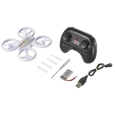 Un drone quadricoptère blanc avec télécommande, hélices de rechange, tournevis, batterie et câble USB, sur une surface blanche.