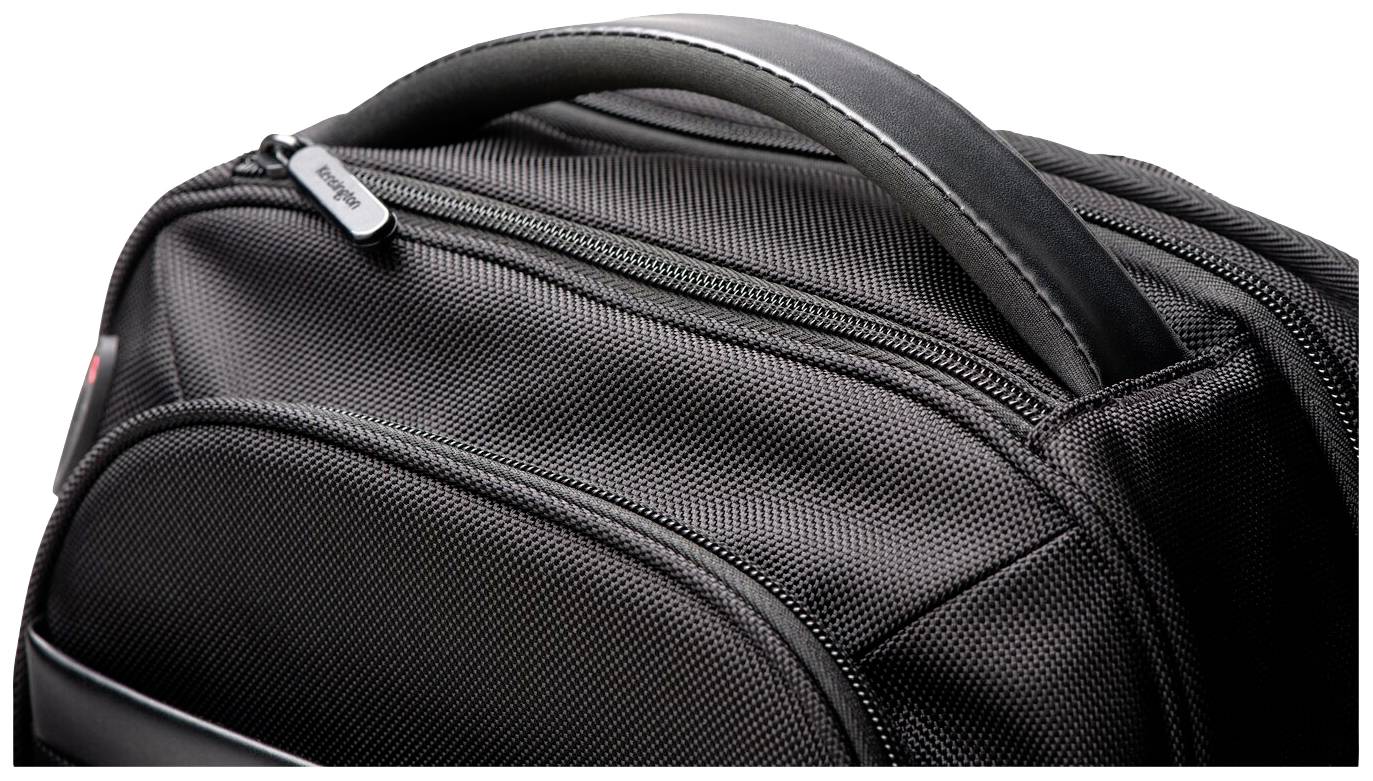 Sac à dos noir en tissu texturé, avec fermeture éclair apparente et poignée, gros plan sur le coin supérieur.