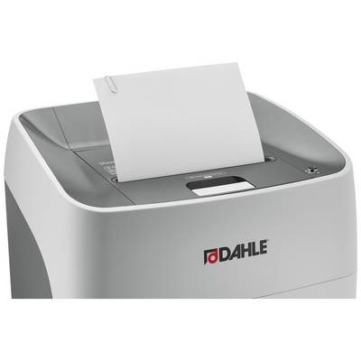 Un destructeur de documents avec une feuille de papier dans la fente d'alimentation. La marque 'Dahle' est visible sur le devant de l'appareil.