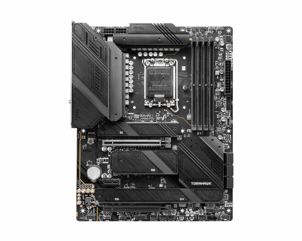 Une carte mère noire avec plusieurs connecteurs et emplacements, incluant un socket CPU et des emplacements RAM. Modèle 'Tomahawk'.