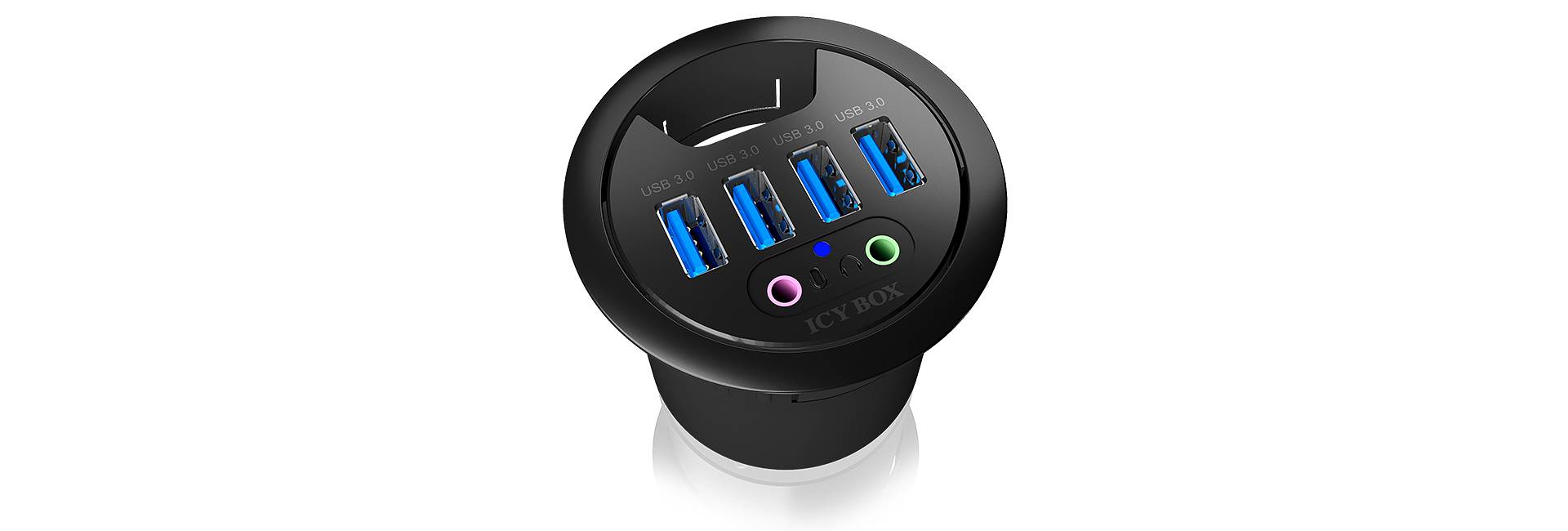 Bureau rond avec prise encastrable, dotée de 4 ports USB et 2 ports audio, convenant à la connexion de plusieurs appareils.