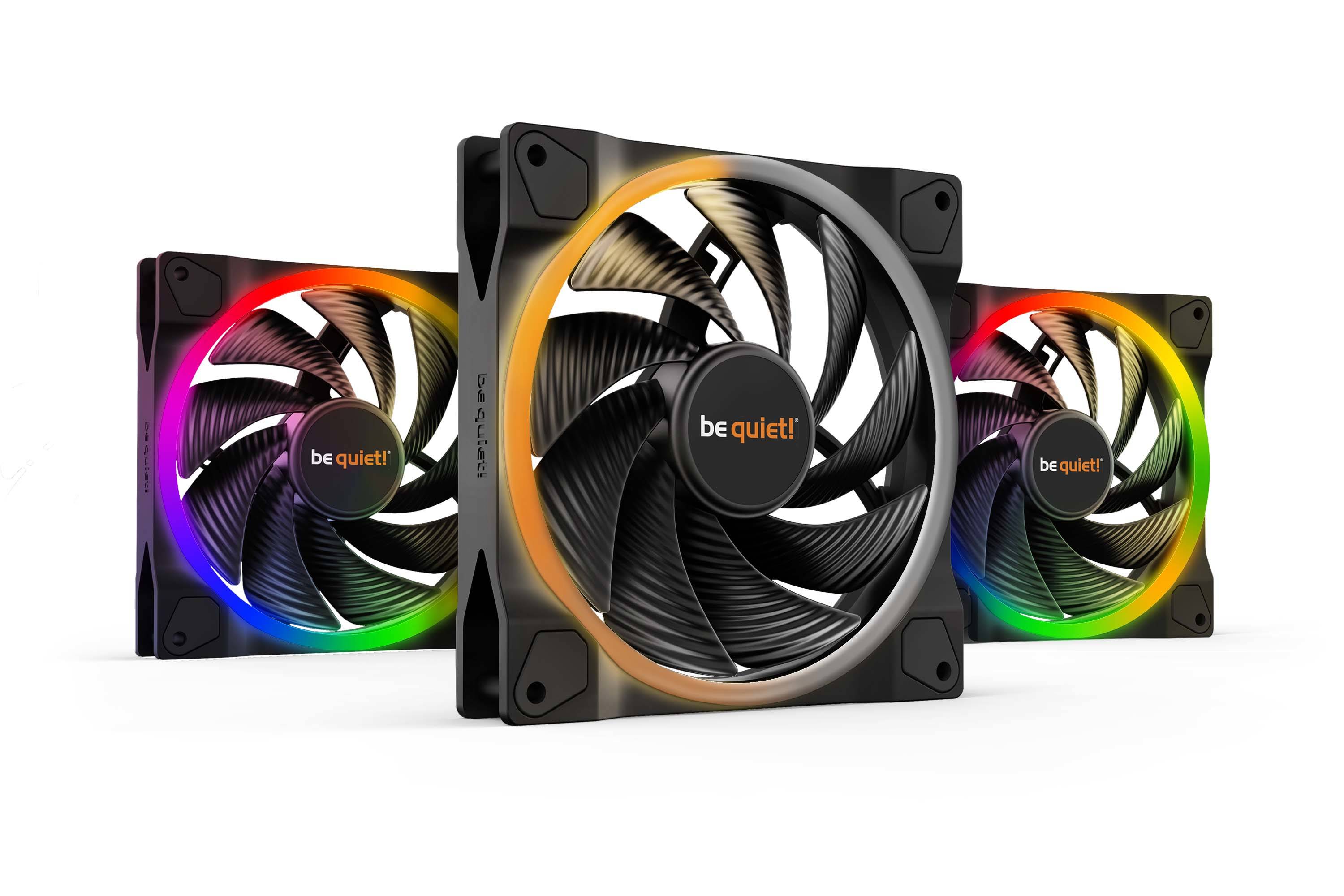 Trois ventilateurs d'ordinateur de la marque 'be quiet!' avec éclairage RVB dans différentes couleurs, disposés en angle.