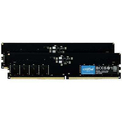 Deux modules de RAM Crucial noirs avec des contacts dorés et un lettrage blanc sur une étiquette bleue. Adaptés pour les mises à niveau d'ordinateurs.