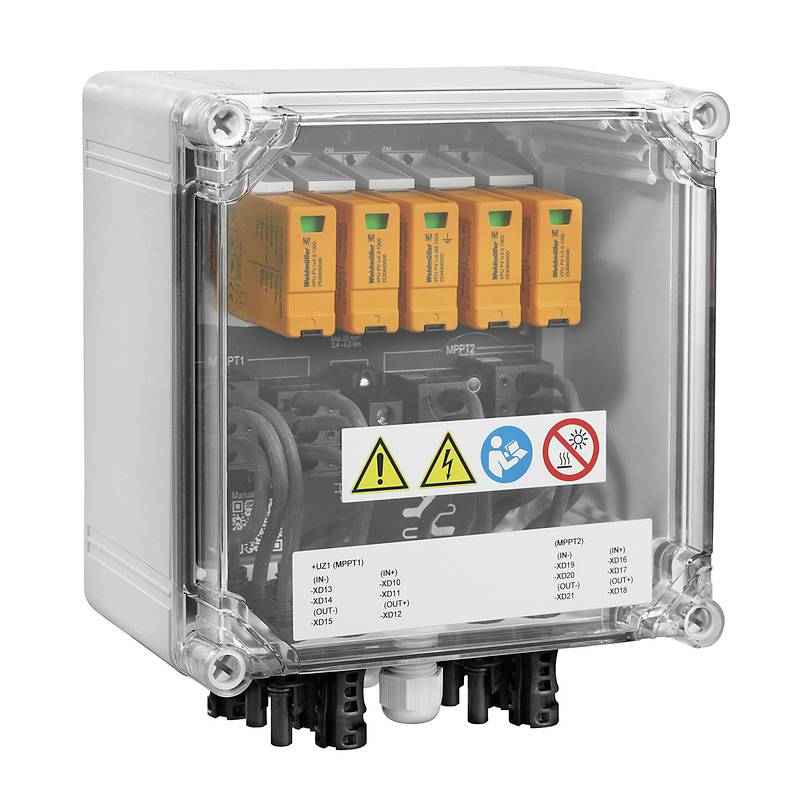 Un boîtier en plastique transparent montre quatre composants électroniques orange avec des câbles de connexion. Des symboles d'avertissement de danger électrique sont présents.