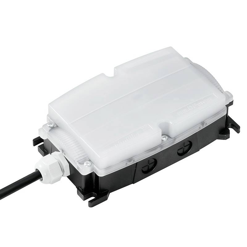Appareil électronique avec boîtier transparent, connexion de câble sur le côté gauche, adapté pour les connexions électriques.