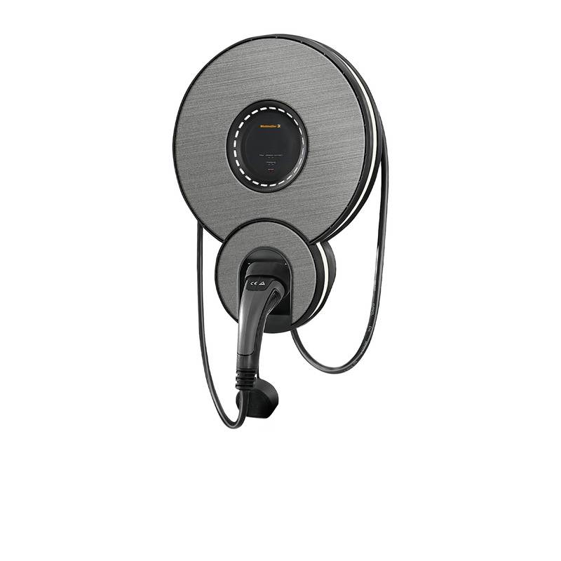 Une station de charge pour voiture électrique ronde et grise, avec un câble et une tête de charge intégrés. Design moderne sans boutons ni affichages visibles.
