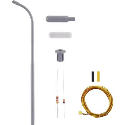 Un ensemble de pièces pour fer à souder : un grattoir à souder gris, deux résistances, des câbles jaunes, et différentes pièces en plastique pour le montage.