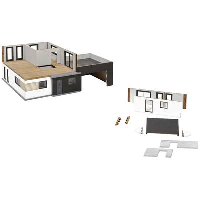 Modèle d'une maison moderne avec des murs et un toit amovibles. Montre les détails intérieurs et des boîtes de construction pour une personnalisation individuelle.