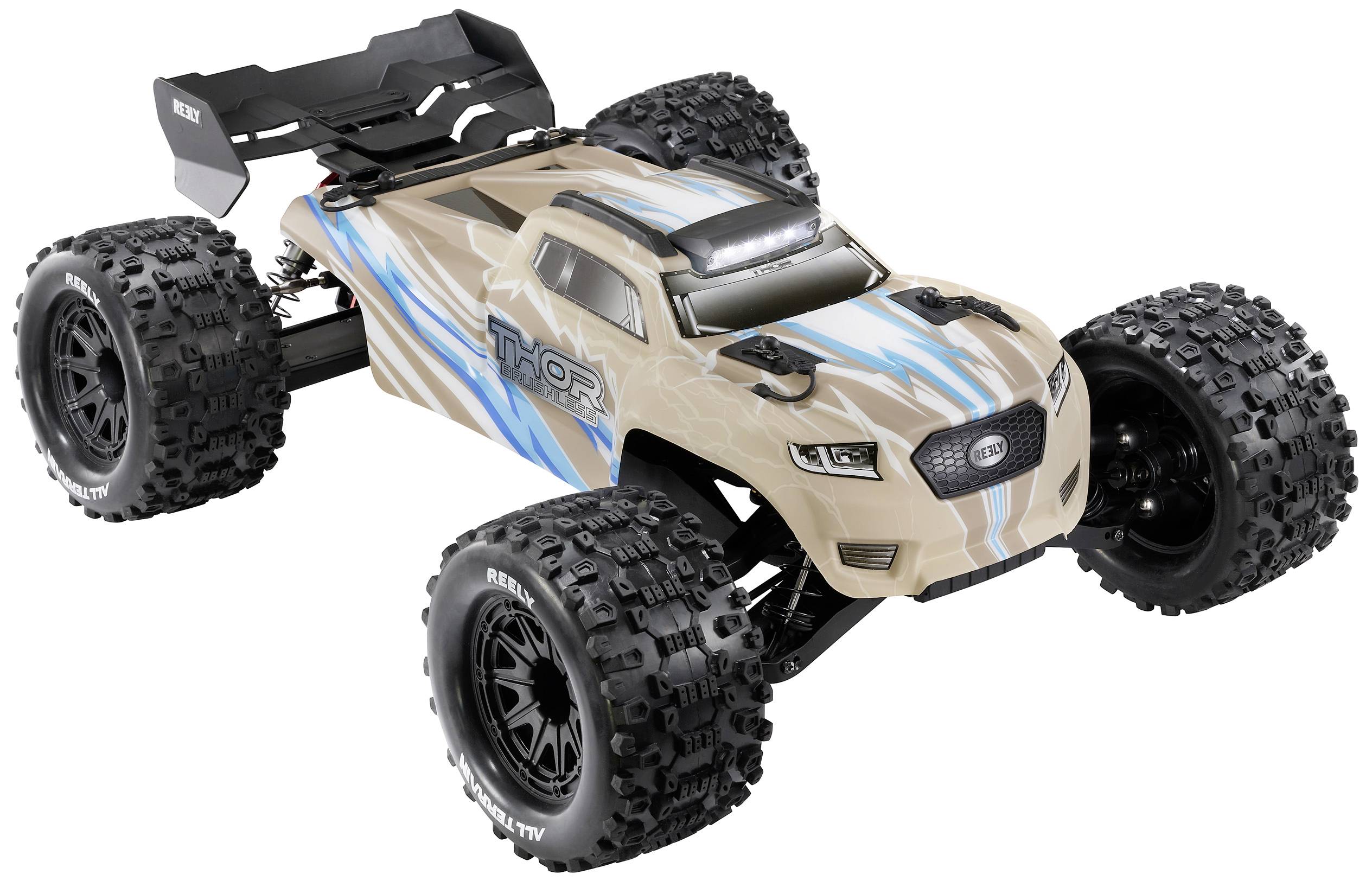 Camion télécommandé avec des pneus à gros crampons, beige avec des accents bleus et noirs. Nom du modèle 'THOR' sur le côté.