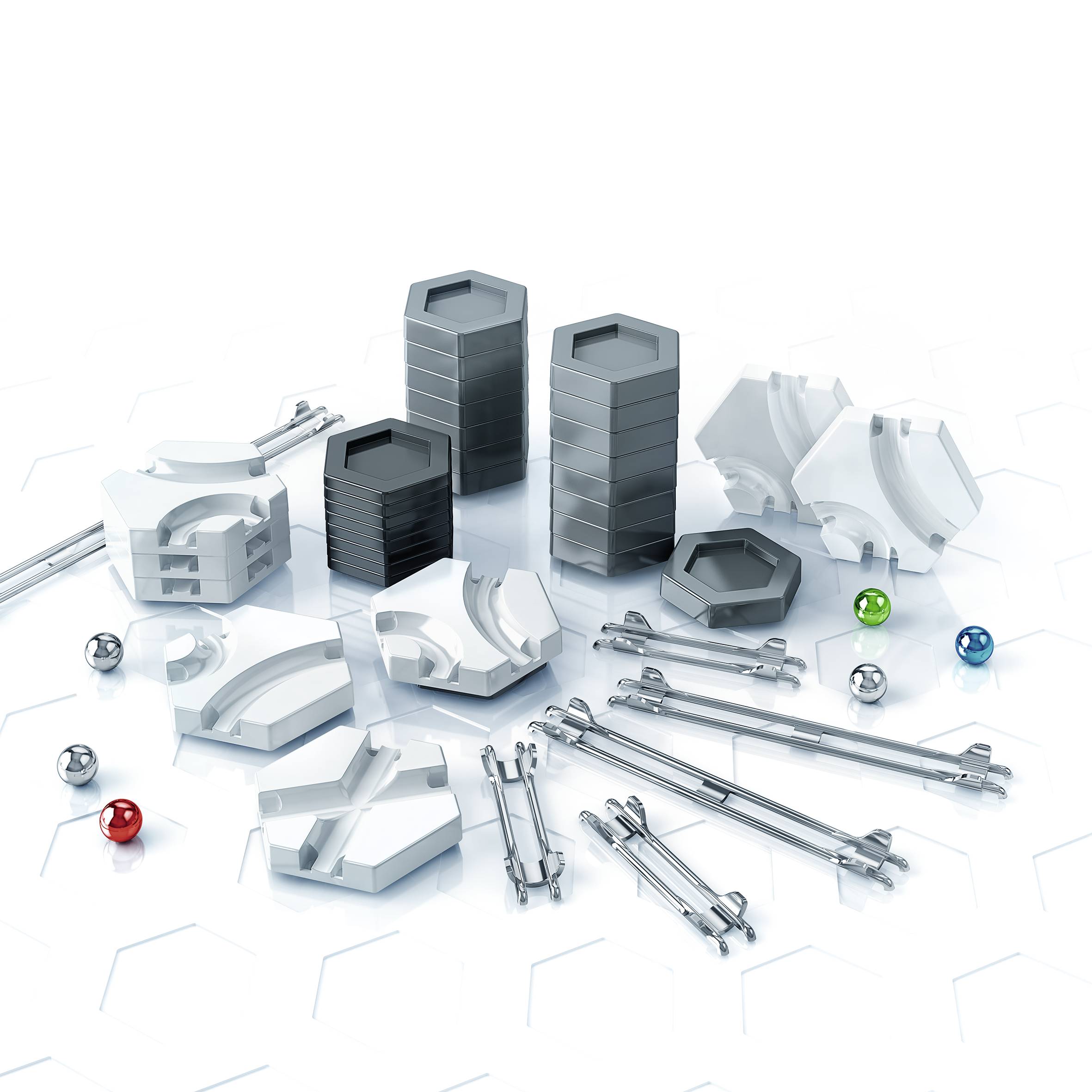 Un ensemble de pièces mécaniques, comprenant des empilements hexagonaux et des objets sphériques de différentes couleurs sur un fond clair.